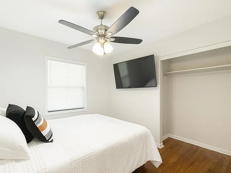 Full sized bed and a 50" TV. Long closet.