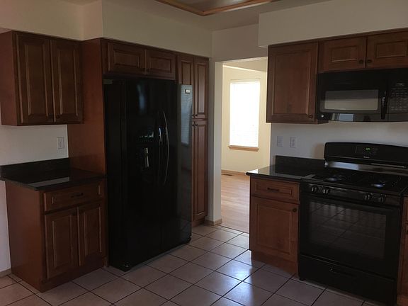 Kitchen with granite counter tops and new appliances