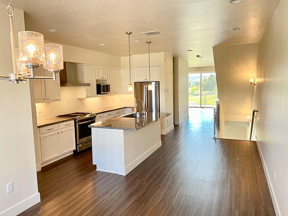 Actual kitchen looking toward great room and 2nd floor balcony