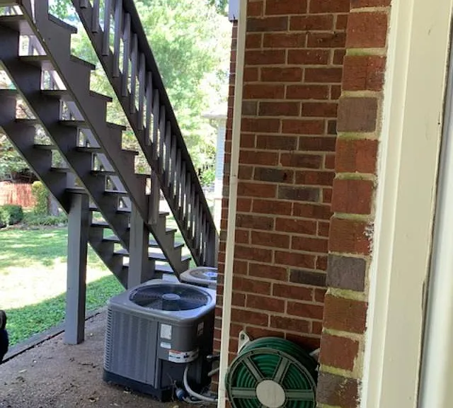 Stairs to deck from lower patio