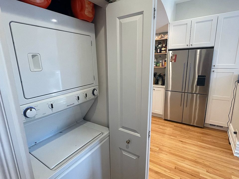 Laundry in the hallway off of the kitchen, main floor bedroom and bath