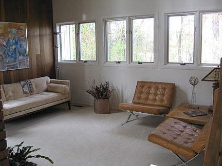 The living room is contemporary in feel with vaulted ceilings.
