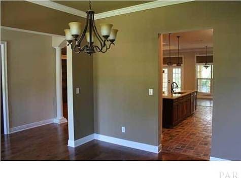 VIEW FROM FORMAL DINING TOWARDS FOYER AND KITCHEN