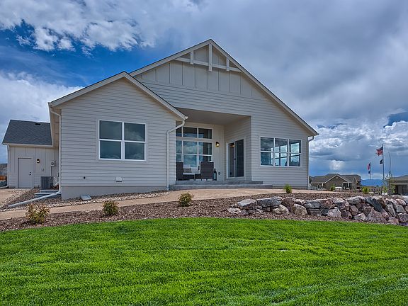 Covered Rear Patio Photo representing home to be built and may demonstrate optional features