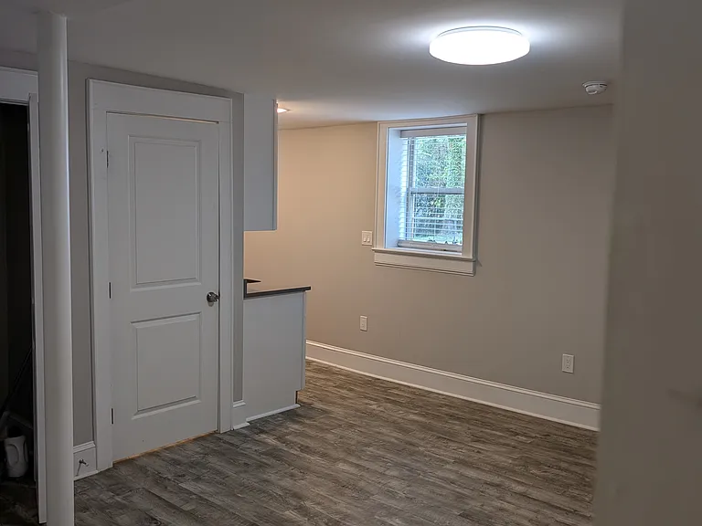 View of main area. Bathroom door closed