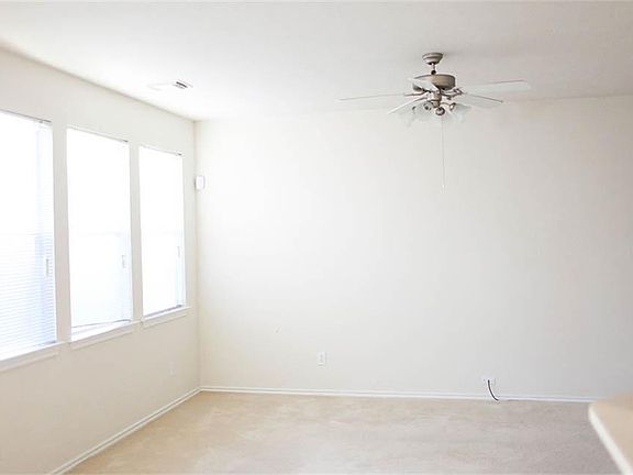 Large family room with lots of windows for natural light.