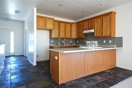 Slate floors throughout kitchen, bathrooms and entry