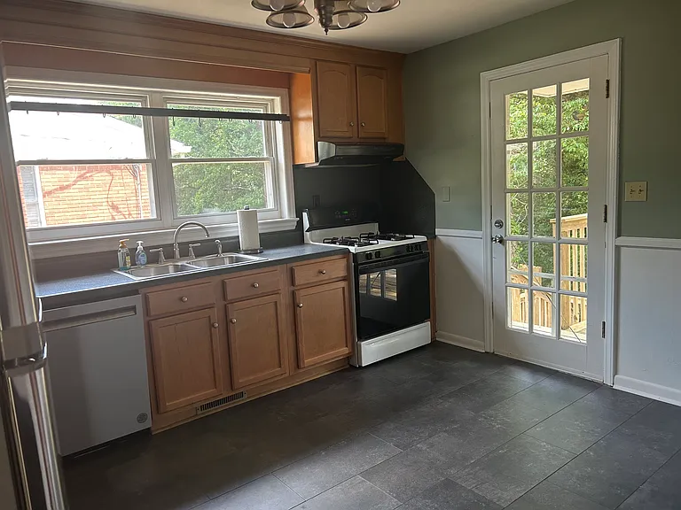 Eat in kitchen. Installed pot rack above sink. GAS stove. Door to back deck