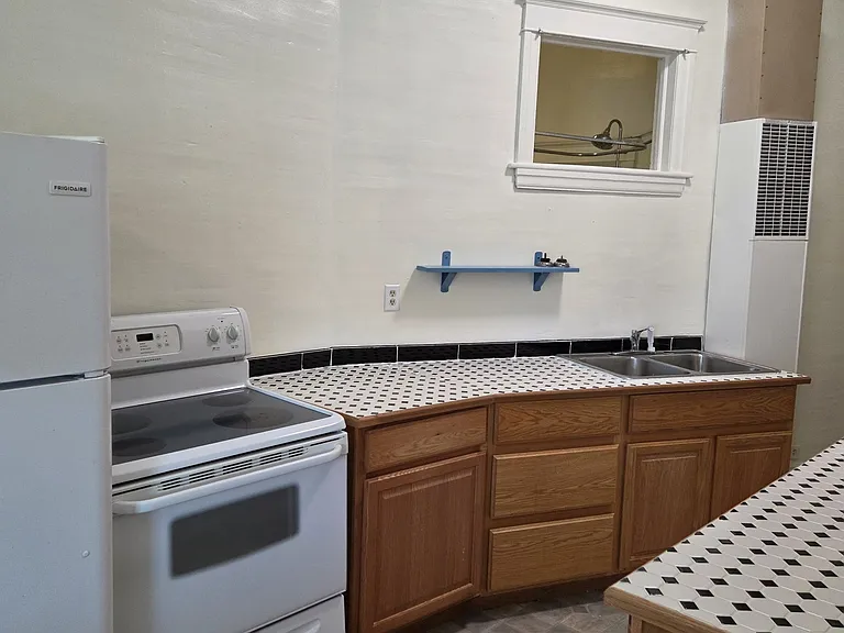 Kitchen with transom window to bathroom for ventilation