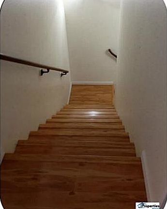 Stairs lead to bedrooms