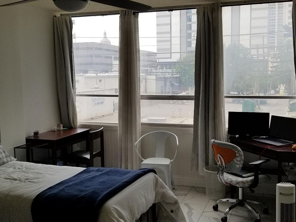 Bedroom with curtains open. (computer not included)