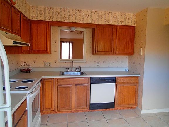 Kitchen features pass-through window to dining room.