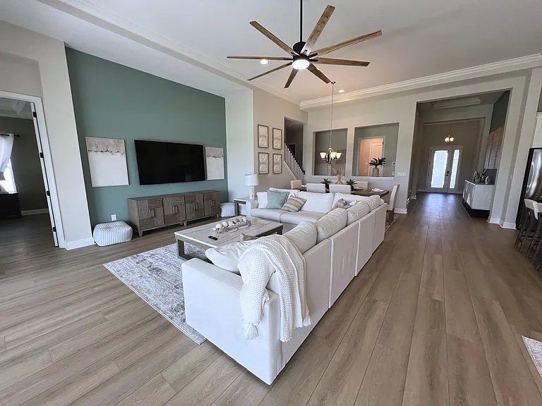 Main floor living room with plenty of seating.