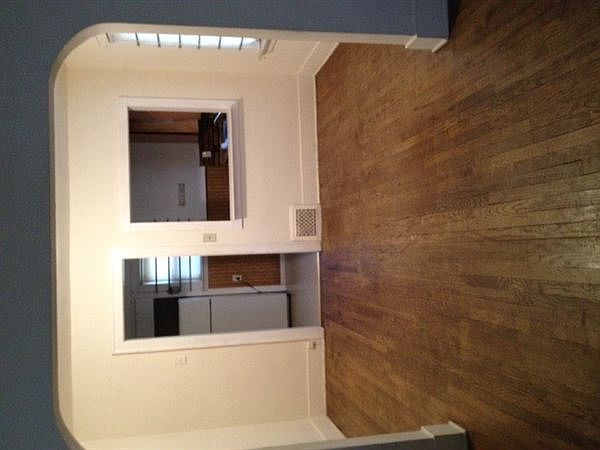 Living room looking into dining room and kitchen