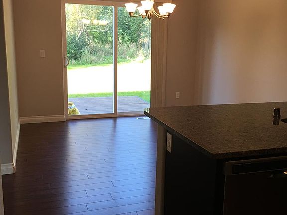 Dine-in kitchen with view of backyard