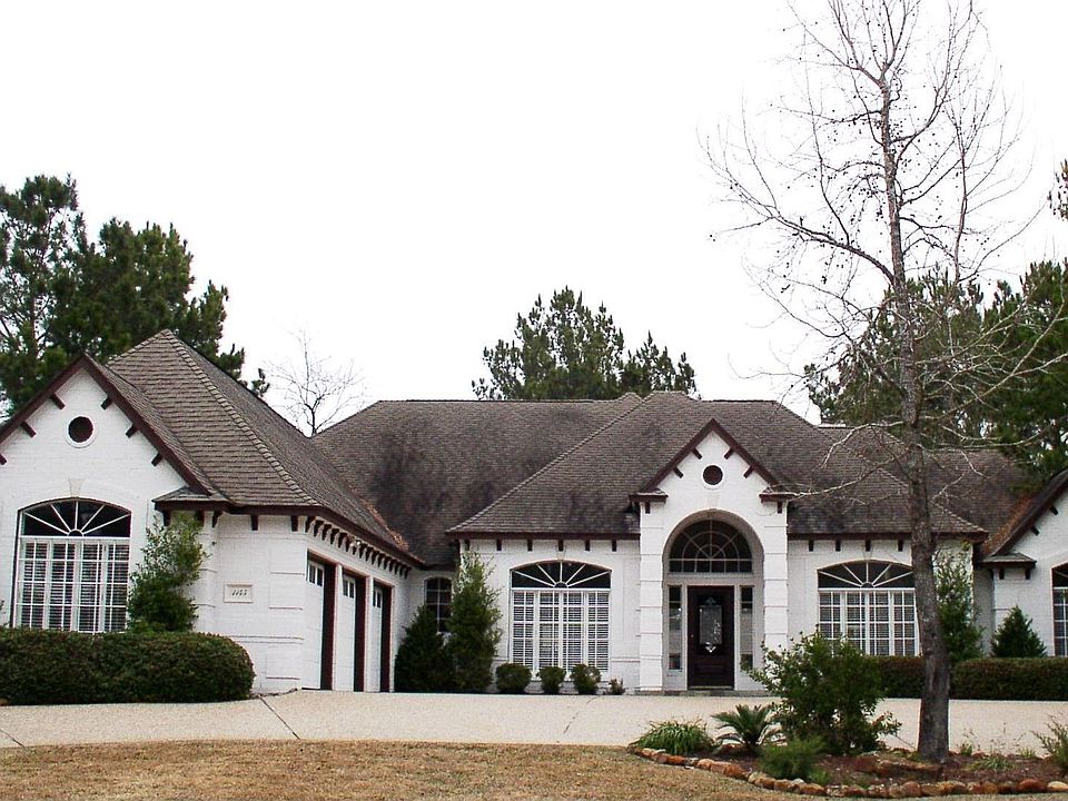 Beautiful white brick home with 3 car garage
