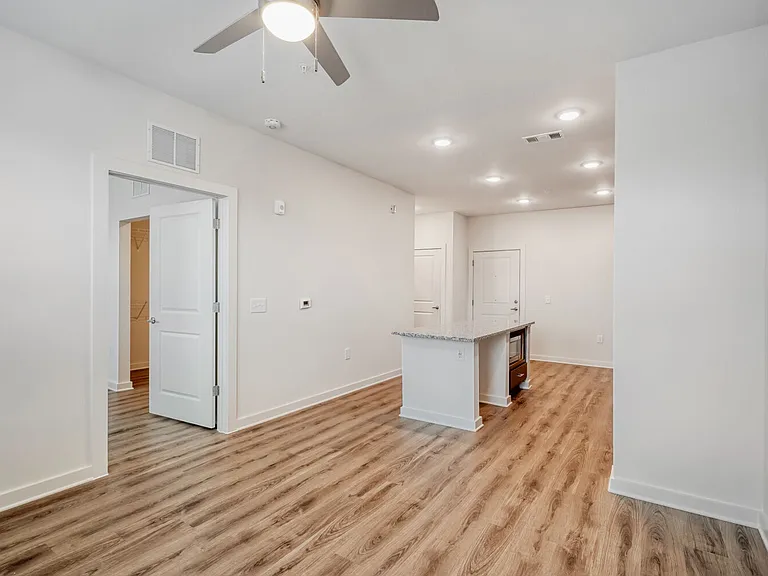 Unit Living Room with Kitchen in the Background