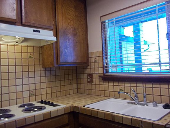 Kithchen with fairly new dishwasher.