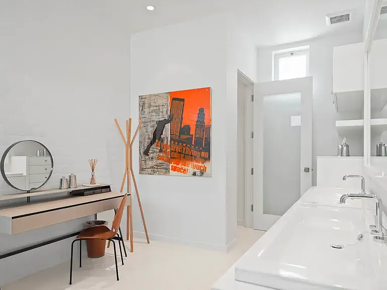 Features an elegant dedicated vanity area for makeup and grooming.