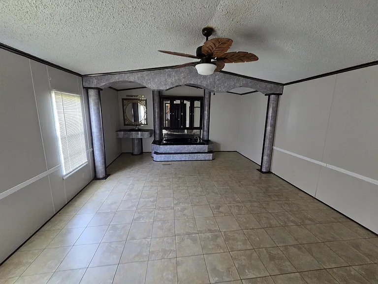 Master Bedroom with sink and tub and fan