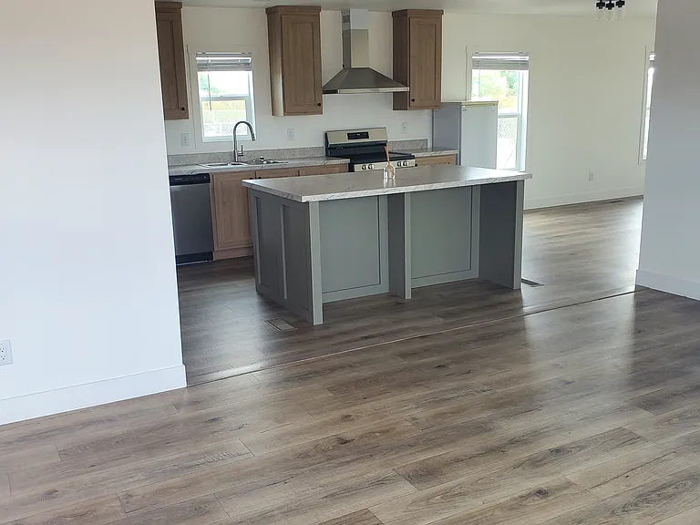 FRONT ROOM LOOKING AT KITCHEN AREA