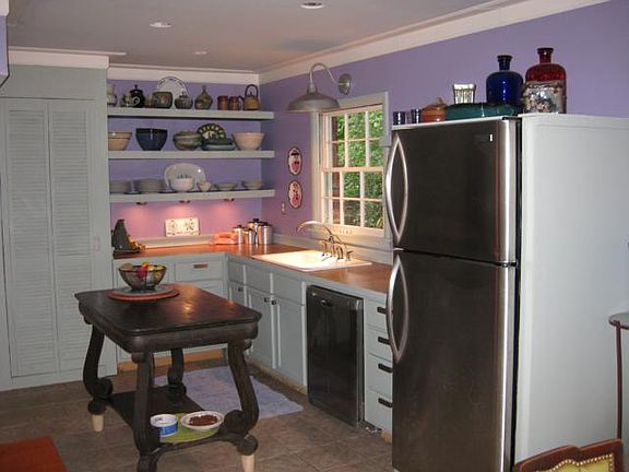 Cozy kitchen with stainless appliances and pantry.