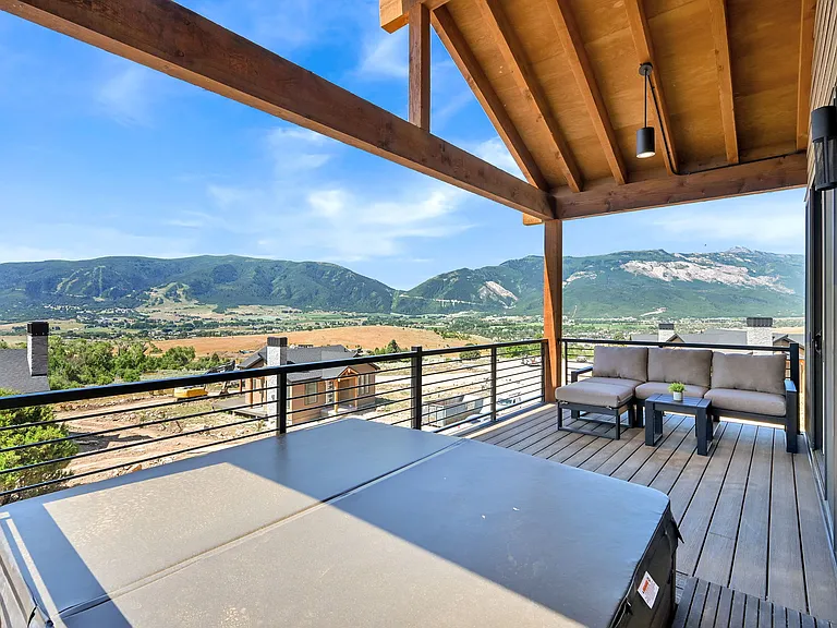 Deck with patio furniture and private hot tub