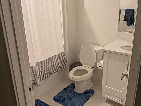 Bathroom dedicated for this room, not directly attached but just outside the room.