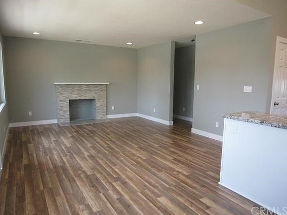 Another view of living room, entryway leads to bedrooms and hall bathroom.