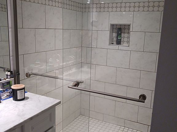 Tiled surround Walk-in shower at Bathroom #2 in Basement.