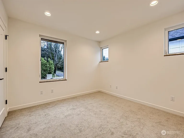 Second bedroom. Carpeted room. Serves as a great office!