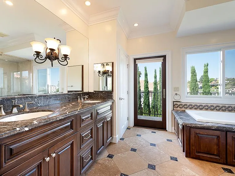 Master Bathroom with built in dresser and walk in closet.