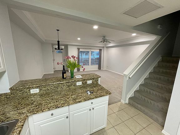 Living room from kitchen (pantry and under-stairs storage not pictured)