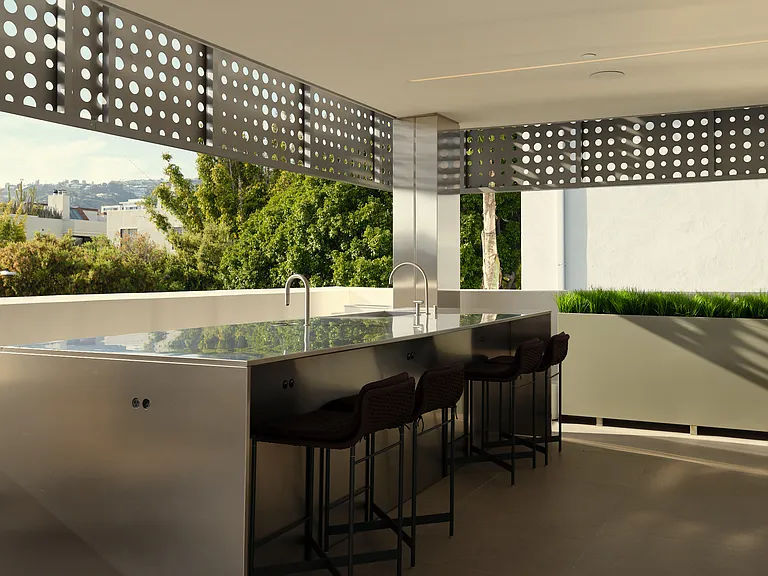 Elevated Outdoor Terrace with Sleek Cafe Bar - Designed for both socializing and relaxation, this open-air terrace features a striking stainless steel Automated Barista bar, integrated sinks, and panoramic views of West Hollywood.