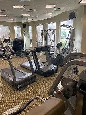 Well-equipped fitness center included in building