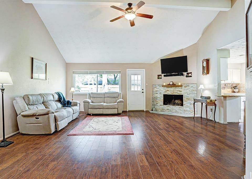 Family Room with Vaulted Ceiling and Updated Wood Burning Fireplace