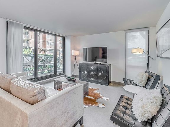 Spacious living room with access to private patio or balcony
