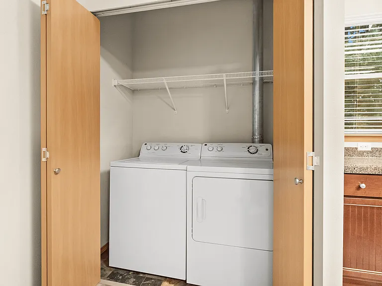 Convenient in-unit laundry with a full-size washer and dryer and built-in shelving. Convenient in-unit laundry with a full-size washer and dryer and built-in shelving.