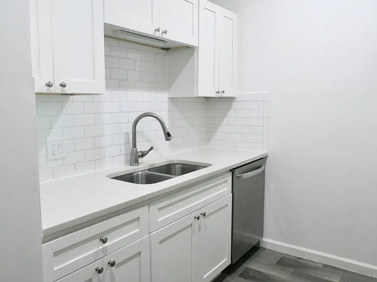 Beautifully Updated Kitchen with Quartz Countertops and Stainless Appliances