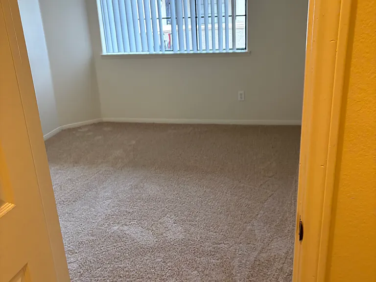 2nd bedroom as seen from its walk-in closet