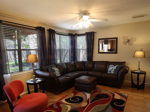 Better shot of the den which is near the fireplace and open to the kitchen