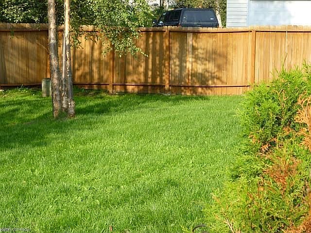 Side of House Landscaped Common Area / Fenced Back Yard