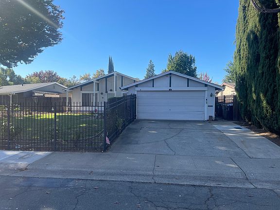 Spacious 2-car garage with additional space on wide driveway