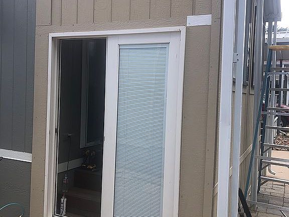 entrance via enclosed patio