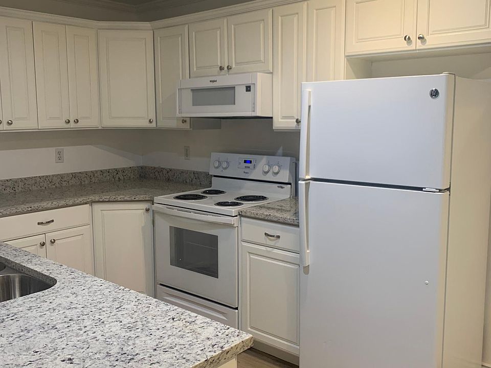 New kitchen granite countertops, sink, faucet, microwave, cabinets, flooring.