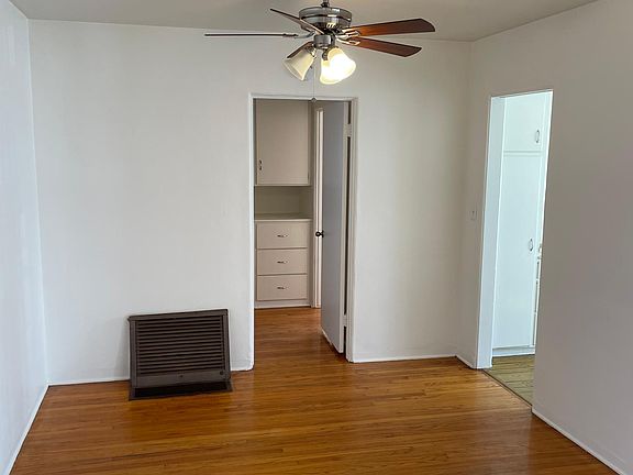 Detailed photo of the dining room area with ceiling fan.