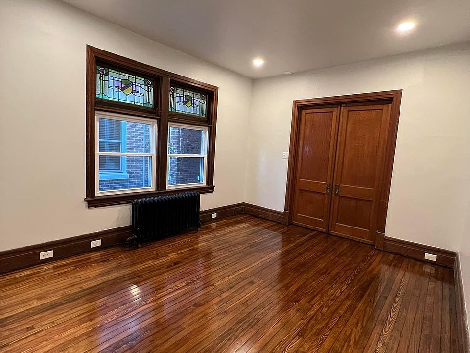 Living room with stained glass and refinished hardwood floors