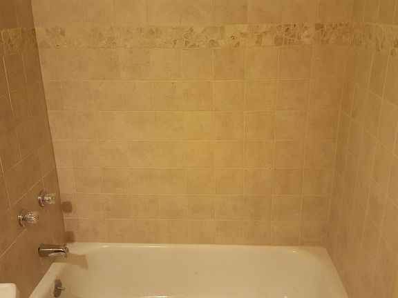 newly tiled bathtub wall