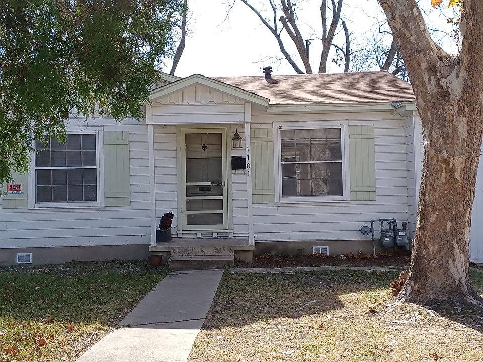 This is the front view of the house with a one-car garage on the right side of the picture.
