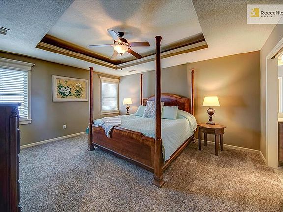 SPACIOUS MASTER BEDROOM WITH POCKET DOOR TO THE MASTER BATH.
